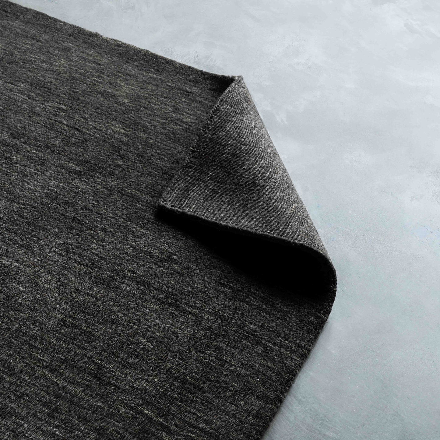 Aviral Handcrafted Black and Grey Wool Soft Rug